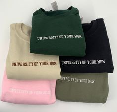 THE ORIGINAL University of Your Mom sweatshirt embroidered on a 50/50 cotton/polyester blend crewneck in hella color choices-sand beige, chocolate brown, forest green, military green light blue, white, black and pink. NOTES: -Standard Processing time is between 1-5 Business Days (We work our butts off to get our orders out sooner than this. During the holidays expect slight delays as we are busier than ever, but know that we are working around the clock to make sure your order gets to you ASAP. Cotton Sweatshirt With Letter Embroidery For Campus, Custom Embroidered Cotton Sweatshirt For College, College Hoodie With Embroidered Text For Fall, College Fall Hoodie With Embroidered Text, School Spirit Cotton Sweatshirt With Embroidered Text, Cotton College Hoodie With Embroidered Text, Cotton Hoodie With Embroidered Text For College, College Fleece Sweatshirt With Embroidered Text, University Of Your Mom