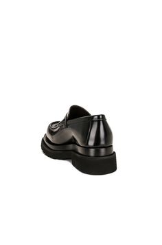 Find BOTTEGA VENETA Lug Loafer Gloss Vinyl on Editorialist. Bottega Veneta Lug Loafer Gloss Vinyl in Black Calfskin leather upper with lug rubber sole. Made in Italy. Penny strap at vamp. Glossy finish. Round toe. Approx 40mm/ 1.5 inch platform Approx 25mm/ 1 inch heel. BOTT-MZ98. 730222-V28R0-1000. About the designer: Bottega Veneta – inspiring individuality with innovative craftmanship since 1966. Creativity lies at the heart of all that we do. Born in Vicenza the house is rooted in Italian culture yet maintains a truly global outlook. An inclusive brand with exclusive products Bottega Veneta is as much of a feeling as it is an aesthetic. Luxury Black Moccasins For Work, Black Leather Platform Loafers For Business Casual, Designer Leather Loafers With Pointed Toe, Designer Leather Moccasins For Work, Designer Leather Moccasins For Office, Leather Moc Toe Platform Loafers For Office, Black Calf Leather Tassel Loafers For Work, Black Calf Leather Loafers For Fall, Black Calf Leather Loafers For Office