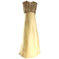 Stunning 60s DYNASTY light yellow beaded and rhinestone raw silk full length evening dress! Features hundreds of hand-sewn sequins, rhinestones and beads on the front and back bodice. Fitted bodice, with a hook-and-eye closure at top center neck (can be worn open or closed). Forgiving full A-Line type skirt. Full metal zipper up the back with hook-and-eye closure. Couture quality, with the majority of the workmanship completed by hand. Luxurious silk shantung holds its shape very nicely. The per Electric Blue Dresses, Yellow Strapless Dress, Couture Gown, Fashion 1960s, Dress With Shawl, Contemporary Dresses, Yellow Silk, Taffeta Dress, Vintage Gowns