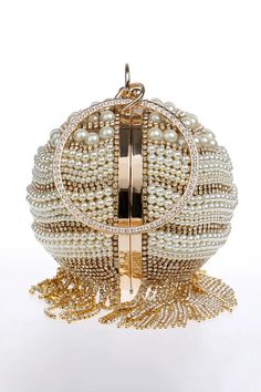 Dazzle in sophistication with our Diamond Pearl Tassel Mini Bag. This exquisite accessory features a luxurious combination of sparkling diamonds and elegant pearls, culminating in a stylish spherical mini bag adorned with playful tassels. Elevate your look and make a statement at any event with the glamour and charm of our Diamond Pearl Tassel Mini Bag. Elegant Round Party Bag, Elegant Evening Clutch With Tassels, Elegant Evening Bag With Tassels, Elegant White Bags With Tassels, Tassel Clutch Evening Bag For Party, Elegant Evening Bags With Tassels, Elegant Bags With Tassels For Events, Elegant Tasseled Bag For Events, Elegant Formal Bags With Tassels