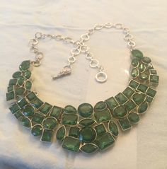 "(MARKED DOWN FROM $75.00) This is beautiful vintage peridot (Glass/crystal?)necklace made with 925 sterling silver. This necklace is in very good vintage condition. The necklace is 18\" in length. As you can see from photo's the stones are absolutely beautiful and set in 925 sterling silver." Unique Green Jeweled Jewelry, Green Sterling Silver Jewelry For Party, Unique Faceted Green Jewelry, Unique Green Faceted Jewelry, Handmade Green Peridot Jewelry, Green Faceted Jewelry For Weddings, Green Faceted Necklace For Party, Green Nickel-free Costume Jewelry, Green Metal Jewelry With Stones