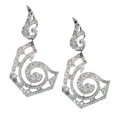 Swirl Motif Diamond Earrings | From a unique collection of vintage dangle earrings at http://www.1stdibs.com/jewelry/earrings/dangle-earrings/ Luxury Diamond Chandelier Earrings, Luxury Diamond Chandelier Earrings With Diamond Cut, Luxury Diamond Chandelier Earrings With Diamond Accents, Luxury Diamond Chandelier Earrings With Accents, Luxury Chandelier Earrings In Diamond White With Elegant Design, Luxury Diamond White Chandelier Earrings With Elegant Design, Luxury Cubic Zirconia Chandelier Earrings, Luxury Diamond White Chandelier Earrings, Luxury Diamond Chandelier Earrings With Sparkle