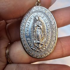 Virgen De Guadalupe Sterling Medallion In 14k Yellow Gold Frame 1.5" X 1" Without Bail Good Condition I Silver Our Lady Of Guadalupe Pendant Jewelry, Silver Our Lady Of Guadalupe Jewelry For Wedding, Commemorative Silver Jewelry With Miraculous Medal, Silver Necklace With Miraculous Medal For Wedding, Silver 14k Stamped Necklace For Commemoration, Silver 14k Stamped Necklaces For Commemoration, Silver Miraculous Medal Jewelry For Wedding, Silver Miraculous Medal For Wedding, Commemorative 14k Stamped Silver Necklace