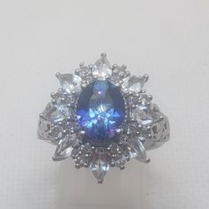 an oval shaped blue and white diamond ring