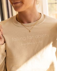 Fall in love with this falling for dainty sweatshirt! With its soft cotton fabric, cozy oversized fit, and classic crew neckline, you'll be sure to look and feel your best! The neutral nude color completes the comfy aesthetic. Add some of your falling for dainty jewelry as the perfect accessory. Details: -S,M,L,XL -Made with 50% sustainably and fairly grown USA cotton -Poly/cotton blend Comfy Aesthetic, The Comfy, Nude Color, Crew Sweatshirts, Dainty Jewelry, Crew Neckline, Fall In Love, Falling In Love, To Look