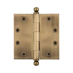 an antique brass finish door hinge with four screws on each side and three holes in the middle