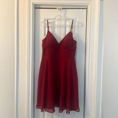 Size: A14 Color: Burgundy Bust: 41 Inches Waist: 34.75 Inches Hips: 44.5 Inches Red Chiffon Dress With Spaghetti Straps, Red Knee-length Bridesmaid Dress, Red Spaghetti Strap Bridesmaid Dress, Red Chiffon Midi Dress For Formal Occasions, Elegant Red Bridesmaid Mini Dress, Red Sundress With Sweetheart Neckline, Red V-neck Chiffon Midi Dress, Red Chiffon Sundress, Red Sleeveless Midi Dress For Bridesmaid