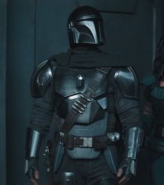 two people dressed as boba fett and darth vader from star wars