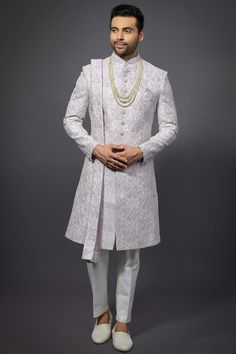 Lavender Silk Fabric Graceful Readymade Men Groom Sherwani For Wedding Fitted Sherwani With Chikankari Embroidery For Groom, Fitted Chikankari Embroidery Sherwani For Groom, Groom's Transitional Sherwani With Chikankari Embroidery, Bollywood Bandhgala With Chikankari Embroidery For Groom, Unstitched Dabka Sherwani For Wedding, Eid Wedding Sherwani With Dabka Embroidery, Long Bandhgala With Dabka For Wedding, Eid Wedding Sherwani With Dabka, Wedding Long Bandhgala With Dabka Details