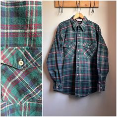 1990s Cotton Plaid Flannel Button Down Shirt * heavyweight cotton flannel * two buttoned flap chest pockets * buttoned cuffs * unlined Label-Winter Run Circa-90s Material-100% cotton Condition-good. minor signs of wear overall Mens Size L-XLarge Shoulders (seam to seam) 19" Pit to Pit 25" Sleeve length (center back of neck to cuff) 36" length (top of shoulder to hem) 32" Measurements: All measurements are taken with the garment laying flat, doubled for the bust, waist and hips make. Please sure Vintage Winter Shirt, Vintage Collared Flannel Shirt With Buttons, Retro Plaid Flannel Shirt With Buttons, Vintage Long Sleeve Flannel Shirt With Buttons, Vintage Collared Flannel Shirt, Vintage Collared Flannel Shirt With Button Closure, Vintage Cotton Flannel Shirt With Button Closure, Vintage Flannel Top With Button Closure, Vintage Flannel Button-up Shirt