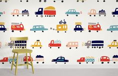 a child's room with cars and trucks on the wall, painted in bright colors