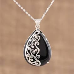 Buy Onyx pendant necklace, 'Mystical Dangle' today. Shop unique, award-winning Artisan treasures by NOVICA, the Impact Marketplace. Each original piece goes through a certification process to guarantee best value and premium quality. Engraved Black Spiritual Jewelry, Engraved Spiritual Black Jewelry, Onyx Necklace With Large Pendant For Gift, Onyx Pendant Necklace With Polished Finish, Unique Black Pendant Necklace, Black Spiritual Pendant Jewelry, Black Onyx Pendant Jewelry, Spiritual Black Pendant Jewelry, Black Spiritual Sterling Silver Necklace