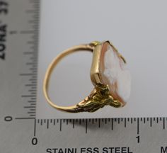 This is a 10K YG Cameo ring, Octagonal Shell cameo with decorations on sides, Circa 1930's, ring size 6, weight 3.5 grams, Nice vintge piece. Excellent condition. Stock #BB68R13 Vintage 14k Stamped Opal Ring For Formal Occasions, Vintage Opal Ring With Polished Finish For Formal Occasions, Antique 14k Gold Signet Ring With Cabochon, Antique Yellow Gold Opal Ring Collectible, Vintage 14k Gold Cameo Rings, Classic Gold Opal Ring Collectible, Yellow Gold Opal Ring Collectible Antique Style, Vintage Round Intaglio Ring, Victorian Yellow Gold Cabochon Jewelry