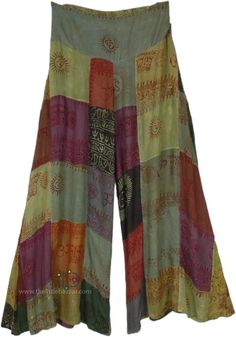 Add a pop of hippie spiritual and free style to your pants collection with these handmade patchwork pants inspired by spiritual prints (Om, Krsna, Hare Rama, etc)! Made with soft, flowy, and breathable organic cotton, these pants feature a green color scheme with unique patchwork designs that are sure to turn heads. The wide legs offer a flowy and comfortable fit, perfect for bohemian and hippie-inspired styles. #tlb #SplitSkirtsPants #Patchwork #BohemianPants Hippie Wide Leg Patchwork Pants, Hippie Wide-leg Patchwork Pants, Bohemian Wide Leg Bottoms With Patchwork, Festival Patchwork Wide Leg Bottoms, Wide Leg Patchwork Bottoms For Festival, Multicolor Patchwork Wide Leg Harem Pants, Bohemian Multicolor Patchwork Bottoms, Hippie Summer Patchwork Pants, Summer Hippie Patchwork Pants