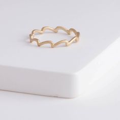 Description 10k yellow gold ring inspired by wavelets. The smooth waves that’s near the shore, the heave of sea on a rainy day, and the splashes created when an animal jumps out of the water are all inspiration of this wave collection. This elegant matte finished ring’s simple and clean look fits every occasion alone, or in your favorite ring stack. Details Gold band - Approximately 2mm from point to bottom (0.75mm band)10k Yellow Gold Made in Japan *This can be ordered to size. Please let us kn Minimalist 14k Gold Wavy Ring, Everyday Yellow Gold Wavy Jewelry, Minimalist Yellow Gold Wavy Ring, Minimalist Wavy Yellow Gold Ring, Everyday Wavy Yellow Gold Jewelry, Wavy Stackable Rings, Minimalist Wavy Yellow Gold Jewelry, Gold Wavy Promise Ring, Ring Stack