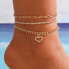 Fashionable 3 Piece Gold Toned Anklet Set. The First Anklet Is A Gold Toned Paperclip Chain. The Second Anklet Is A Simulated Diamond Tennis Style Anklet. The Third Anklet Is A Gold Toned Chain Anklet With Dangling Heart That Features Simulated Diamonds. Wear Them Together Or Separately To Change Your Look. The Paperclip Anklet Is Approx. 9.75” With A 2.5” Extension The Tennis Style Anklet Is Approx. 8.75” With A 2.75” Extension The Dangle Heart Anklet Is Approx. 9.25” With A 3” Extension See My Heart Paperclip, Layered Cross Necklace, Heart Ankle Bracelet, Gold Layered Bracelets, Diamond Anklet, Butterfly Anklet, Anklet Set, Anklet Chain, Embellished Fashion