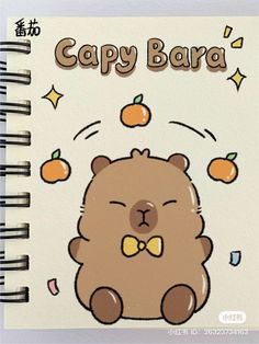 a spiral notebook with an image of a brown bear and oranges on the cover