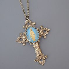 Vintage Jewelry - Cross Necklace - Blue Mother Mary Necklace - Catholic Necklace - Brass Necklace - Chloe's Vintage Jewelry This is such a gorgeous vintage piece. An extraordinary layered cross with a lovely vintage cabochon of Mother Mary. Exquisite detail with a rich patina. The pendant hangs from a lovely vintage ladder chain. Chloe says, "Wear it and feel fabulous!" The pendant is 4" long and 2 1/4" wide.  You can choose the necklace length you would like at checkout. Thanks for visiting Chl Mother Mary Necklace, Large Cross Necklace, Vintage Ladder, Mary Necklace, Catholic Necklace, Cross Jewelry Necklace, Jewelry Cross, Vintage Jewelry Necklace, Brass Necklace