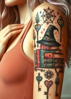 a woman's arm with books, keys and a wizard hat on top of it