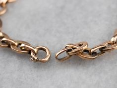 This chain bracelet has a classic design that makes it easy to pair with a variety of looks! Oval-shaped links gleam in warm rose gold, with a substantial presence on the wrist, yet comfortable to wear. A safety chain helps to keep this bracelet secure. Metal: 14K Rose Gold Width of Chain: 5.3 mm Length of Chain: 8 Inches Marks: "14K" Stamped on the clasp Classic Metal Chain Bracelet At Cheap Price, Luxury Rose Gold Box Chain Bracelets, Luxury Rose Gold Box Chain Bracelet, Luxury Rose Gold Classic Chain Bracelet, Luxury Tarnish-resistant Rose Gold Chain Bracelet, Gold Chain Bracelet, Safety Chain, Gold Bracelet Chain, Infinity Bracelet