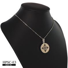 "circle shaped pendant curved with the symbol of the Kingdom of Jerusalem, which existed for almost two hundred years after the First Crusade the large cross is shown slightly \"potent\", but that is not always the case. The four smaller crosses are said to symbolize either the four books of the Gospel or the four directions in which the Word of Christ spread from Jerusalem. Alternatively, all five crosses can symbolize the five wounds of Christ during the Passion. This symbol is used in the fla White Gold Etched Round Pendant Necklace, Etched White Gold Round Pendant Necklace, Symbolic Carved White Gold Jewelry, Engraved White Gold Amulet Necklace, White Gold Engraved Spiritual Necklace, Spiritual Engraved White Gold Necklace, White Gold Engraved Spiritual Necklaces, White Gold Amulet Necklace With Large Pendant, Carved White Sterling Silver Necklaces