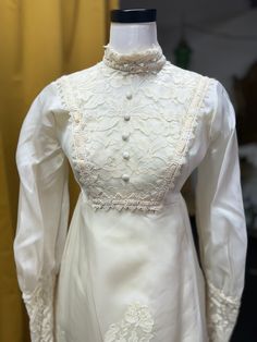 a white dress on display in a room