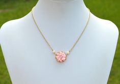 "Featuring a delicate Dahlia in Blush Pink. Drop a note if you prefer different color. Detail : Hand sculpted Dahlia made of Polymer Clay . Size approx: 19mm Glued on Gold Plated over brass Filigree (20mm). Cream Swarovski Pearls Gold Plated chain, Antiqued Brass and Silver Plated available. Entire length 15\" + 2 extenders. made in The USA Note : if you prefer sterling silver or gold filled chain, please contact me. PRODUCTION TIME: The picture are only for sample. Most Items are made to order Necklace With Wedding Dress, Elegant Handmade Pink Flower Necklace, Delicate Pink Flower Shaped Necklace, Feminine Pink Flower Shaped Necklace, Delicate Pink Flower-shaped Necklace, Pink Flower Necklace, Adjustable Pink Flower-shaped Necklace, Brass Filigree, Yellow Sunflower