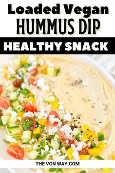 hummus dip healthy snack on a plate with text overlay that reads loaded vegan hummus dip healthy snack