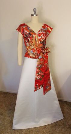 "V-neck / French sleeve dress top and OBI sash with vintage red wedding KIMONO UCHIKAKE gold brocade. Gorgeous woven patterns of phoenix and flowers. Size--- US8~10 *Please refer to finished garment measurement. *The mannequin on the picture is US8. Finished garment measurements; Bust-38 1/2\" (98cm Waist-31 1/2\" (80cm Middle Hip-42 1/2\" (108cm Shoulder-13 3/5\" ~ 14 1/2\" (35~37cm) Sleeve-3\"~ 4\" 8~10cm              * This style would be nice for a loose fit as well              * The final Fitted Silk V-neck Kimono, V-neck Kimono For Wedding, Spring Wedding Satin Kimono, Elegant Red Kimono For Wedding, Elegant Fitted Kimono With Floral Print, Traditional Fitted Kimono For Wedding, Traditional Fitted Wedding Kimono, Vintage Red Wedding, French Sleeve