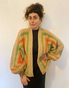 "Our lovely cosy knitwear is hand knitted by our team in the UK. Each one has its own unique colour and pattern and no two are the same.  Our knitwear is created from mixed wool using left over pieces from our other projects and follows our zero waste aesthetic. This includes wool and acrylic fibres. This beautiful sweater has cropped balloon style sleeves and squares of crochet. Oversized for that slouchy, cosy feel! We also make to order.. please contact us if you have a particular colour way in mind! MEASUREMENTS (approximate) Pit to pit unstretched laid flat 30\" Length shoulder to hem 27\" Length of sleeve from neckline 27\" CARE INSTRUCTIONS Handle as delicate cool wash Dry flat Do not tumble dry" Spring Cozy Sweater In Acrylic Yarn, Cozy Acrylic Yarn Sweater For Spring, Cozy Fall Knitting Pattern With Open Knit, Oversized Hand Knitted Spring Sweater, Cozy Crochet Outerwear One Size, Cozy Knitted Patterns For Fall, One Size Acrylic Yarn Cardigan For Fall, Cozy Oversized Crochet Outerwear, Multicolor Oversized Open Knit Sweater