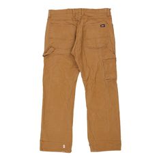 Vintage Dickies brown carpenter trousers, fit a 37" waist and 31" inseam. WAIST: 37 inches / 94cmsINSEAM: 31 inches / 79cmsRISE: 12 inches / 30cmsGENDER: mens CONDITION: good - faint marks on back.STYLE: carpenter trousersERA: 1990sCOLOUR: brownFABRIC: cotton Utility Brown Jeans For Fall, Brown Workwear Pants With Pockets, Brown Utility Jeans For Fall, Brown Work Pants With Pockets, Brown Wide Leg Utility Pants, Full Length Brown Cargo Pants, Brown Utility Bottoms For Workwear, Brown Straight Leg Bottoms With Multiple Pockets, Brown Full-length Cargo Pants With Belt Loops