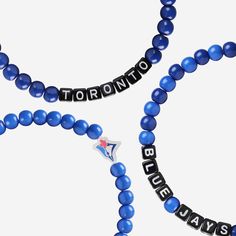 A whole new way to rep the team in style is here. Step up your fan fashion sense with this Toronto Blue Jays 3 Pack Beaded Friendship Bracelet. These matching friendship bracelets have an all-over team-colored design and team logo displays, which makes them the perfect way to show your support for the Toronto Blue Jays on gamedays and every day in between. Every bead bracelet design is the perfect addition to your outfit, whether you’re heading to the game, watching at home, or just hanging out Personalized Blue Bracelets For Game Day, Blue Team Spirit Jewelry For Game Day, Personalized Blue Bracelets For Sports Events, Blue Adjustable Bracelets For Team Spirit, Blue Beaded Bracelets With Letter Beads For Team Spirit, Blue Adjustable Beaded Bracelets For Team Spirit, Casual Blue Jewelry For Game Day, Blue Team Spirit Beaded Bracelets As Gift, Blue Beaded Bracelets For Team Spirit Gift