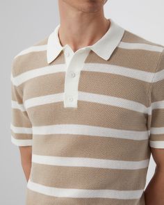 An update to a traditional casual silhouette, our Cotton Textured Polo is knit from either solid or dual-colored threads that highlight the intricacy of the stitch. It has a functional three-button placket framed by a crisp collar and ribbed trim that enhances its streamlined feel. The Cotton Textured Knit Polo is styled with the Linen Fixed-waist Short. Classic Collared Jacquard Knit Polo Sweater, Fitted Knit Polo Sweater With Button Closure, Classic Textured Knit Polo Shirt With Collar, White Knit Polo Sweater With Ribbed Collar, White Elegant Collared Polo Sweater, Elegant White Polo Collar Sweater, Elegant White Polo Sweater, Classic Fitted Polo Sweater With Striped Collar, Classic White Polo Sweater