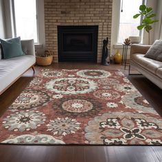 a living room filled with furniture and a large rug on top of a hard wood floor