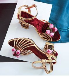 The Lucy Floral Heels are the ultimate in elegance with vintage vibes. They are perfect for day and night, beautifully handcrafted in velvet decorated with flowers and beads. The main attraction is unique birdcage heels. Wear it with an elegant dress and you are good to go. Specifications: Side Vamp Type: Open Heel Height: High (5cm-8cm) Closure Type: Buckle Strap Back Counter Type: Front & Rear Strap Fashion Element: Flower Pattern Type: Floral Handmade *** Fits true to size, take your normal s Gold Sandals For Spring Prom, Gold Wedding Shoes For Summer Events, Gold Block Heel Wedding Shoes For Summer, Summer Wedding Shoes In Gold For Events, Vintage Low Heel Wedding Shoes For Party, Gold High Heel Wedding Shoes For Spring, Gold Open Toe Wedding Shoes For Spring, Vintage Round Toe Wedding Shoes For Party, Spring Cocktail Gold Heels