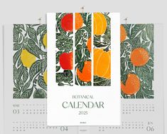 three calendars with oranges and leaves on them