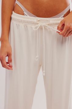 Dream away in these easy sleep pants from Intimately, featured in a wide-leg style and lightweight cotton fabrication for ultimate comfort and effortless wear. **Fit:** Mid-rise, relaxed **Features:** Lightweight cotton blend, adjustable drawcord waistband, exposed seams **Why | Sleep Space PJ Pants by Intimately at Free People in White, Size: XL Solid Wide Leg Sleepwear For Spring, Solid Color Wide Leg Sleepwear For Spring, Cotton Wide Leg Sleep Bottoms, Comfortable Stretch Wide Leg Sleepwear, Relaxed Wide Leg Sleepwear With Elastic Waistband, Wide Leg Cotton Sleep Bottoms, Cotton Wide Leg Sleepwear For Lounging, Cotton Wide Leg Sleepwear For Relaxation, Cotton Wide-leg Sleepwear For Lounging