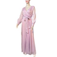 Beautiful Y2K lilac purple satin maxi dress. Size M. Polyester satin material with vertical metallic silver stripe detail. Wrap style bodice. Elasticized waist. Long sleeves with 3-gold buttons at wrists. Fully lined. Wrap satin fabric belt. Slips overhead - no zippers. Approximate Measurements (laid flat) Chest 38" Waist 28" Hips 38" Length 57" Sleeve Length 24" Shoulder-to-Shoulder 15" In excellent condition. Purple Satin Maxi Dress For Night Out, Lavender Fitted Floor-length Maxi Dress, Fitted Lavender Floor-length Maxi Dress, Elegant Mauve V-neck Maxi Dress, Lavender Fitted Maxi Dress For Evening, Fitted Lavender Maxi Dress For Evening, Purple Satin Floor-length Maxi Dress, Purple Floor-length Maxi Dress For Night Out, Purple Satin V-neck Maxi Dress