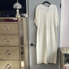 Ivory/ Cream;Approximately Waist -17.5”; Length -53.5”; Missing Fabric Tag Cream Sheath Midi Dress For Work, Elegant Long Neutral Dress, Classic White Maxi Dress For Spring, White Long Dress For Work, Long White Dress For Work, Elegant Long Off-white Dress, Elegant Long Off White Dresses, Cream Maxi Dress For Spring Workwear, Elegant Cream Maxi Dress With Short Sleeves