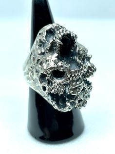 Jewel made entirely by hand by the Italian craftsman Gianmarco Fontana. Ring made of 925 Silver, which is part of the "SKULLS" collection depicting Paranoia. This ring represents the transformation and progression of Paranoia. Psychosis characterized by the development of a chronic, coherent delusion, which evolves slowly, leaving the remaining psychic functions intact. Luxury Silver Skull Ring For Formal Occasions, Unique Silver Skull Ring Hallmarked, Unique Sterling Silver Skull Ring With Polished Finish, Handmade Silver Skull Ring, Symbolic Style, Handmade Symbolic Silver Skull Ring, Handmade Silver Symbolic Skull Ring, Handmade Silver Skull Ring, Unique Silver Skull Ring Collectible, Handmade White Gold Skull Ring For Anniversary