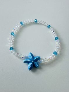 This will come with the pattern and color beads in the picture, and a blue starfish. This bracelet will come 7 inches long ( standard women's wrist) The bracelet is also made with stretchy string. This will also come with a satin bag and a polishing cloth. ANY QUESTIONS AT ALL OR CUSTOM ORDERS PLEASE DON'T HESITATE TO MESSAGE ME I WILL GET BACK TO YOU ASAP! -Please roll-on bracelets to avoid   over-stretching. -As with any bead that is not a precious  metal you should not expose your bracelets  to water or direct sun also natural body oils,  lotions, and other materials could cause   discoloration. -Each bracelet is handmade with love by me so no two will be exactly the same. FREE SHIPPING ON ORDERS OF $35 OR MORE Cheap Beaded Bracelets With Heart Beads For Beach, Adjustable Blue Bracelets With Starfish Charm, Turquoise Beaded Bracelets With Starfish Charm, Blue Bracelets With Starfish Charm And Round Beads, Blue Bracelet With Starfish Charm And Round Beads, Turquoise Starfish Beaded Bracelets, Ocean-inspired, Blue Bracelets With Starfish Charm Ocean-inspired, Blue Starfish-shaped Beaded Bracelets As Gift, Blue Beaded Bracelet With Starfish Charm