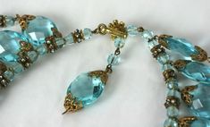 For Sale on 1stDibs - Impressive Miriam Haskell Aquamarine Crystal and Diamonte Bib of faceted faux aquamarine oval crystals, signature Russian gilt filigrees and hundreds of Elegant Aquamarine Faceted Beads Jewelry, Elegant Aquamarine Jewelry With Faceted Beads, Buddha Necklace Gold, Red Choker Necklace, Blue Diamond Necklace, Byzantine Necklace, Red Choker, Miriam Haskell Jewelry, Gold Leaf Necklace