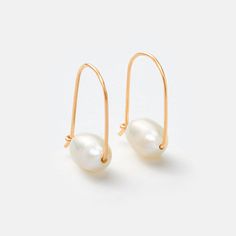 Elegant and modern, these Gold Small Floating Pearl Hoop Earrings feature a distinctive pearl drop for a fresh take on traditional hoop earrings. 1" long drop earring About 1/4" x 3/8" pearl size. Each pearl varies in size. Recycled 14k gold filled Minimalist Teardrop Hoop Earrings With Pearl Charm, Pearl Teardrop Hoop Earrings With Pearl Drop, Everyday Teardrop Pearl Pendant Earrings, Formal Teardrop Hoop Earrings With Pearl Charm, Modern Teardrop Earrings With Pearl Charm, Modern Hoop Earrings With Pearl Charm, Minimalist Small Hoop Pearl Drop Earrings, Minimalist Teardrop Pearl Pendant Earrings, Modern Drop Pearl Earrings With Pearl Charm