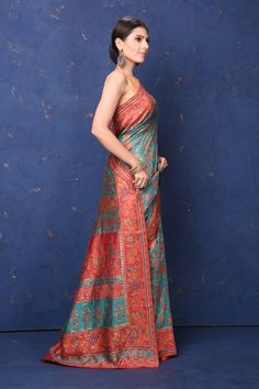 Beautiful blue Kani weave saree with red border is an exquisite piece for your ethnic wardrobe. It comes with a matching blouse piece. Shop designer sarees in USA from Pure Elegance. Disclaimer: The shown stitched blouse on the model is for display purpose only. The saree comes with a matching blouse piece and finished with fall and piko. The actual product may vary slightly from the image. These are custom orders, hence expect slight variation in color, placement of the motif or buta. ESTIMATED DELIVERYBecause this is a custom order, it would take about 4 weeks from the date of purchase. RETURN POLICYThis product is a custom order and cannot be returned or exchanged. Bollywood Sarees, Sarees Cotton, Latest Designer Sarees, Red Border, Pure Elegance, Fashion Journals, Traditional Fabric, Saree Online, Cotton Sarees