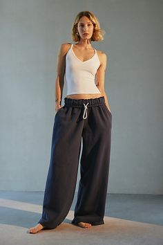 Out From Under sweatpant made special with piping details. Designed in a relaxed wide-leg silhouette featuring a ruffled elastic waistband with drawstring tie, side pockets and split hems. Exclusively at Urban Outfitters. Features Out From Under Hoxton piping wide leg sweatpant Wide leg sweatpant Soft and stretchy knit Ruffled elastic waistline with drawstring tie Side pockets with contrast piping down the sides Split hems Relaxed wide-leg fit Full length Easy pull-on style UO exclusive Content + Care 69% Cotton, 31% polyester Machine wash Imported Size + Fit Model in Ivory is 5’8" and wearing size Small Measurements taken from size small Inseam: 30" | Out From Under Hoxton Piping Sweatpant in Navy, Women's at Urban Outfitters Wide Leg Sweatpants Outfit, Sweats Aesthetic, Urban Outfitters Sweatpants, Sweatpants Aesthetic, Cute Sweats, Wedding Week, Sweatpants Outfit, Wide Leg Sweatpants, Contrast Piping