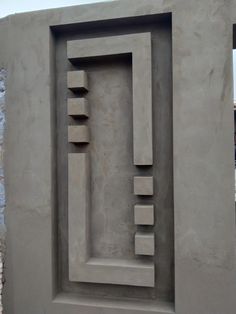 a cement sculpture is shown in the shape of a square, rectangle and column