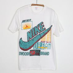 Original 1990s Nike Just Do It Shirt. This is a true vintage shirt, not a modern reproduction. Sizes vary so please use measurements for best idea on fit. No back graphics. Shirt is in excellent condition, no holes, no stains. This shirt comes laundered and ready to wear. 90s Style White Shirt With Graphic Print, White Retro Print T-shirt For Streetwear, Vintage White T-shirt With Graphic Design, 90s Retro Print Top For Streetwear, 90s Style White Shirt With Screen Print, Retro Crew Neck Shirt With Vintage Print, Vintage Crew Neck Shirt With Graphic Print, Vintage Graphic Design Shirt For Summer, Vintage Summer Shirt With Graphic Design