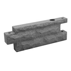 two concrete blocks with holes in the middle and one on each side, both facing different directions