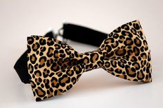 This trendy and stylish bow tie is great for so many occasions!Bow tie made of 100% cotton with a matching, adjustable neck strap. Style:• The Pre-Tied Bow Tie• The Clip-On Bow TieAll our bow ties can be made in the following sizes, just specify which size you need in a note at checkout: Sizes:Baby: 3.5" x 2"Kids: 4" x 2"Youth: 4.25" x 2.25Adult: 5" x 2.5"All our bow ties are made by hand; therefore, measurements are a guideline only and cannot be guaranteed. Neck strap sizes:Baby – adjustable t Animal Print Accessories, Adjustable Black Bow Tie For Summer, Black Adjustable Bow Tie For Summer, Dapper Summer Party Ties, Adjustable Bow Tie For Summer Party, Summer Party Adjustable Bow Tie, Adjustable Bow Tie With Butterfly Knot For Summer, Summer Bow Tie With Adjustable Butterfly Knot, Adjustable Summer Bow Tie With Butterfly Knot