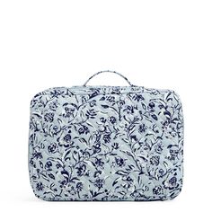 a blue and white floral print bag on a white background